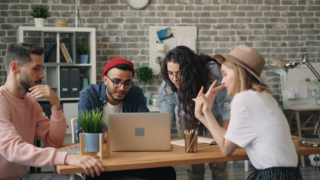 employees in team discussion